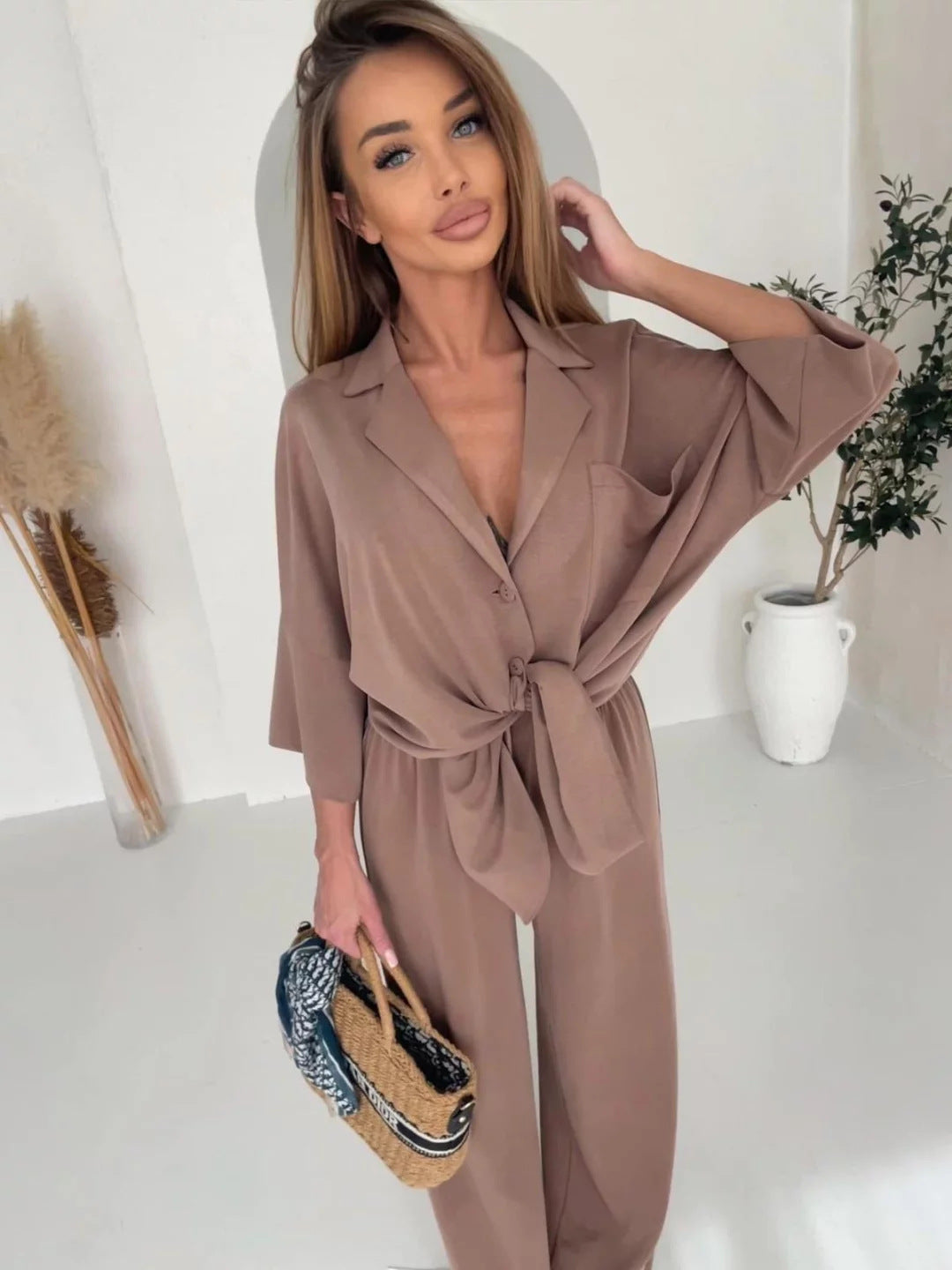 Damen Jumpsuit mit Bindegürtel und weiten Beinen Eveloria