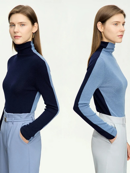 An image of a woman side by side  wearing a mock neck, dual toned sweater in light and dark blue showing off the two shades when worn in different styles.
