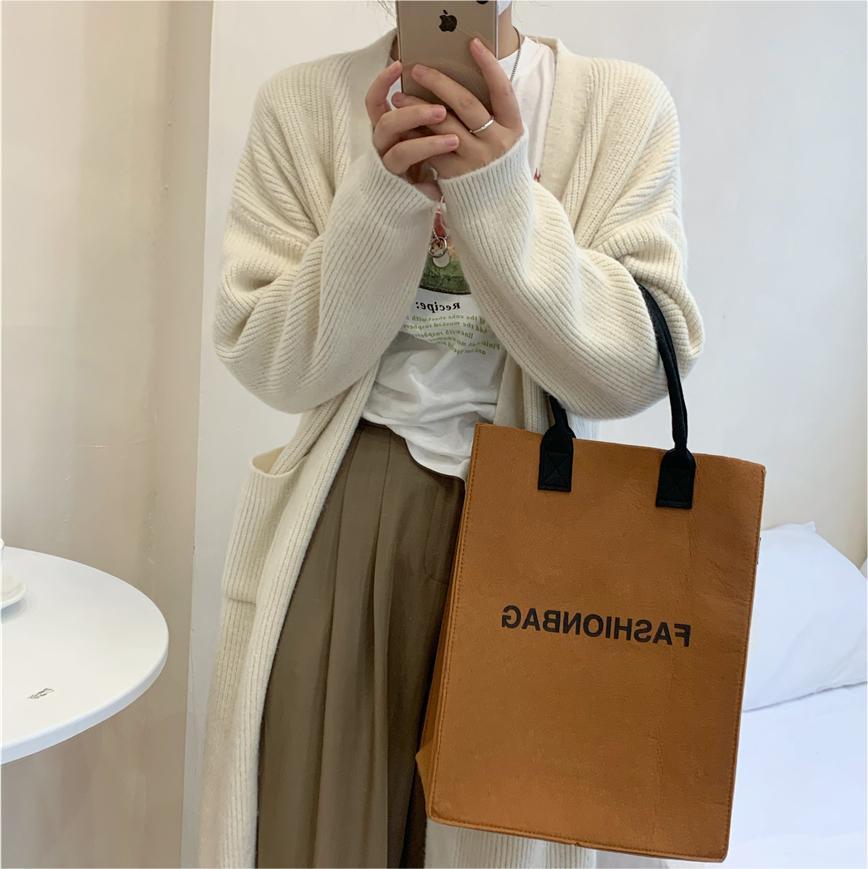 Damen Grobstrickcardigan mit Taschen und modischem Schnitt wird