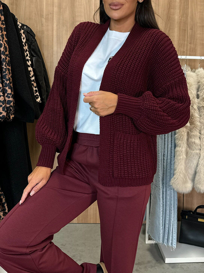 Damen Strickjacke Voluminöse Ärmel Taschen Eveloria