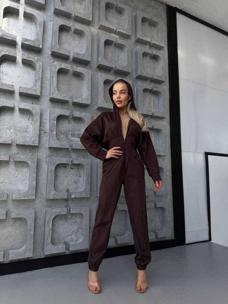 Damen Jumpsuit Tiefes Dekolleté Kapuze Eveloria