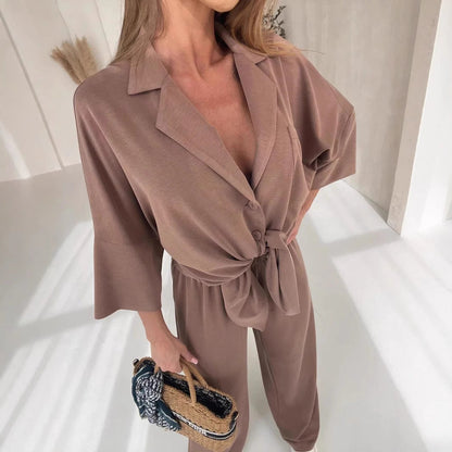 Damen Jumpsuit mit Bindegürtel und weiten Beinen Eveloria