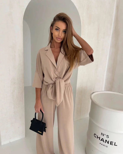 Damen Jumpsuit mit Bindegürtel und weiten Beinen Eveloria