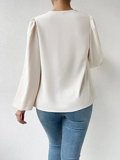 Elegante Damenbluse mit Drapé-Ausschnitt und langen Ärmeln